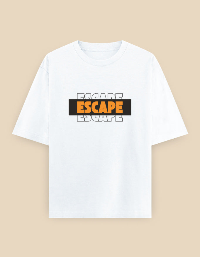 White oversized t-shirt featuring a bold layered "ESCAPE" typography graphic in orange, black, and white on the front.