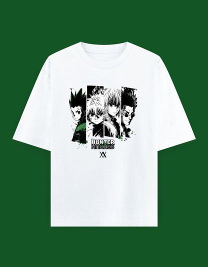 White oversized t-shirt featuring an anime-inspired character collage with green accents printed on the front.