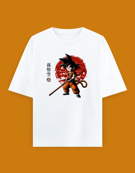 Dragon Ball oversized T-shirt featuring Young Son Goku with the Power Pole, Saiyan tail, and Japanese Son Gokū text against a crimson sun