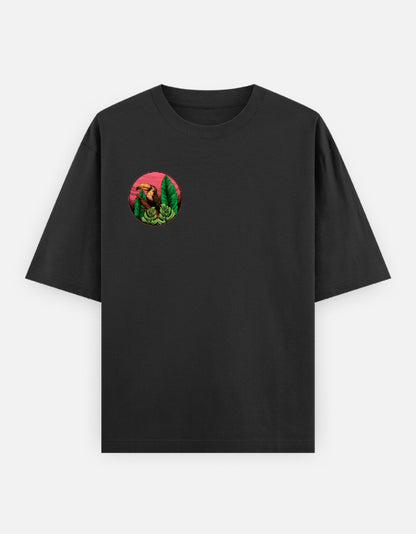 Oversized T-shirt featuring a bear surrounded by forest foliage and a sunset-inspired background.