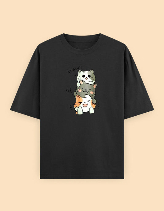 Black oversized t-shirt featuring three adorable stacked kawaii cats with playful expressions printed on the front.