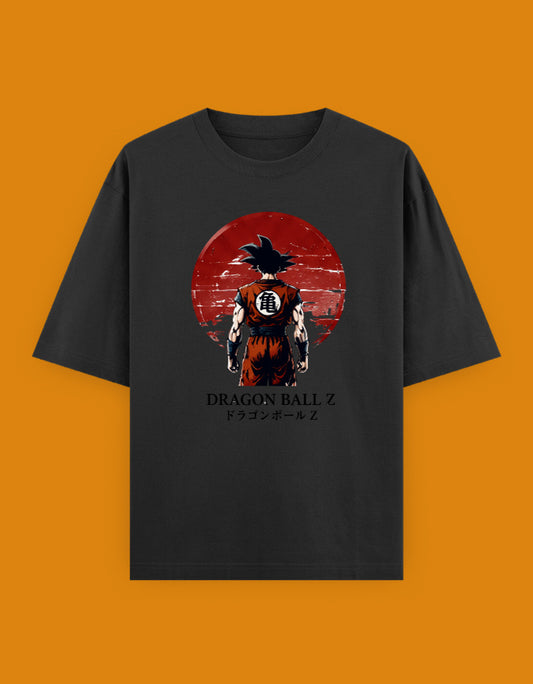 Dragon Ball Z oversized T-shirt featuring Son Goku from the back with the Kame symbol on his gi and a crimson sun background