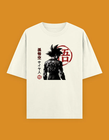 White oversized t-shirt featuring a monochrome anime-inspired Saiyan warrior illustration with red Japanese typography and minimalist streetwear styling.jpg
